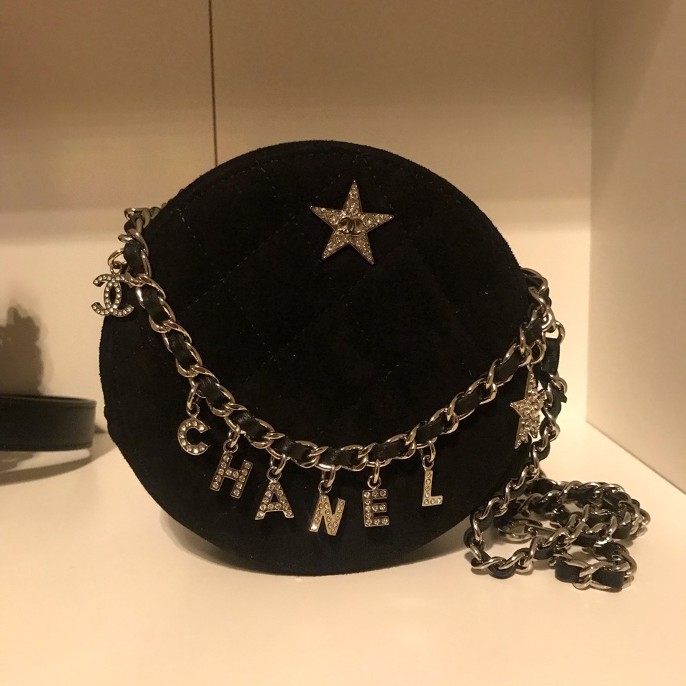 Authentic Chanel round clutch with charms
